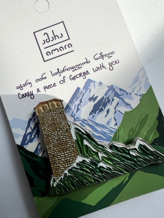Svanetian Tower enamel pin inspired by the medieval defensive towers of Svaneti in the Georgian Caucasus Mountains - სვანური კოშკი - pin attached to the card.